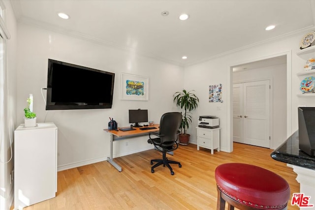 office featuring hardwood / wood-style flooring and crown molding