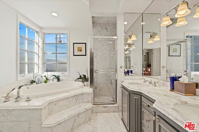 bathroom with separate shower and tub and vanity