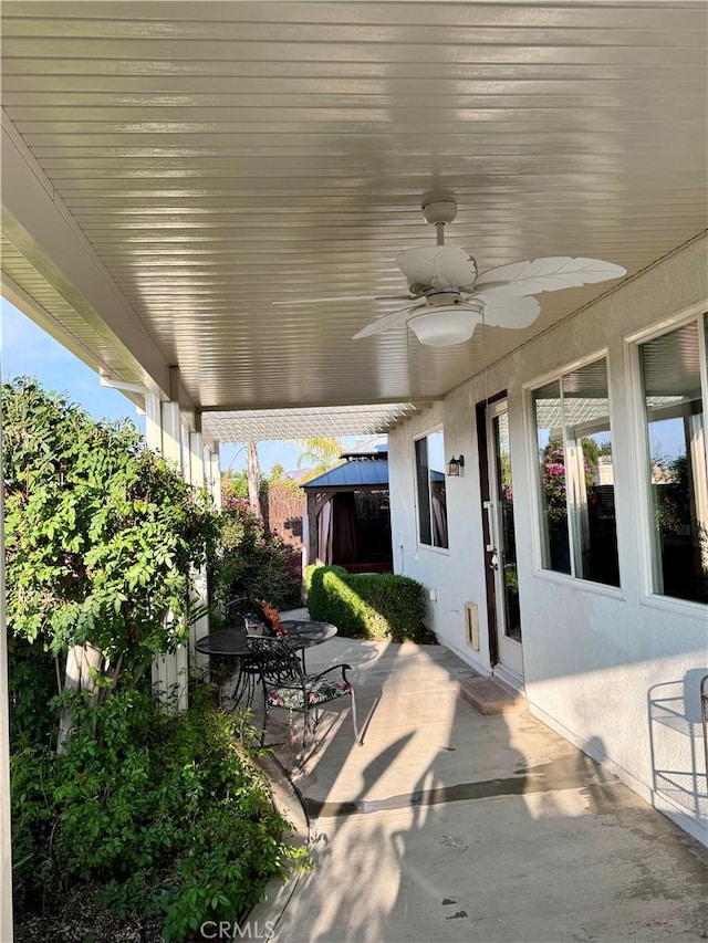 view of patio with a gazebo and ceiling fan