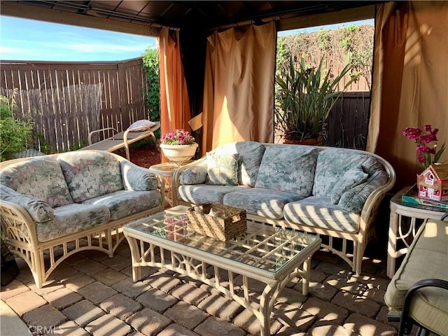 view of patio with an outdoor hangout area and a gazebo