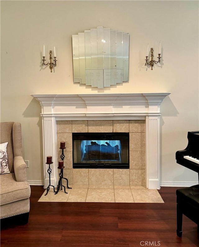 interior details with a fireplace and wood-type flooring