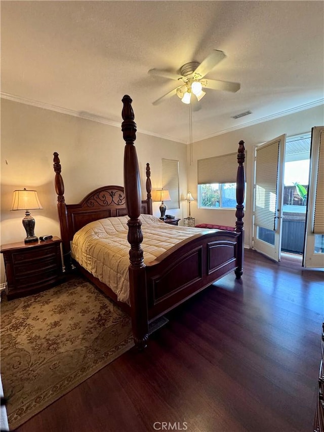 bedroom with ceiling fan, dark hardwood / wood-style flooring, ornamental molding, and multiple windows