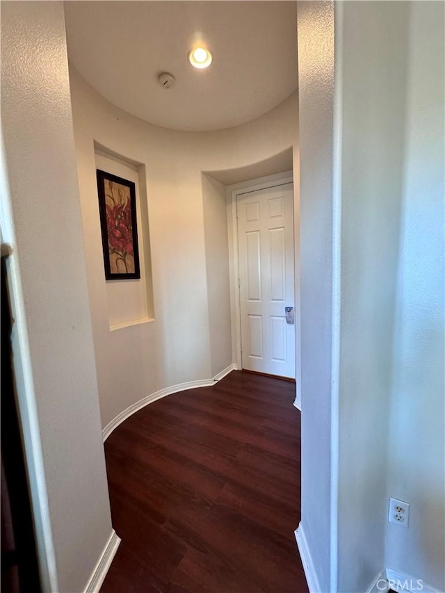 hallway featuring dark hardwood / wood-style floors