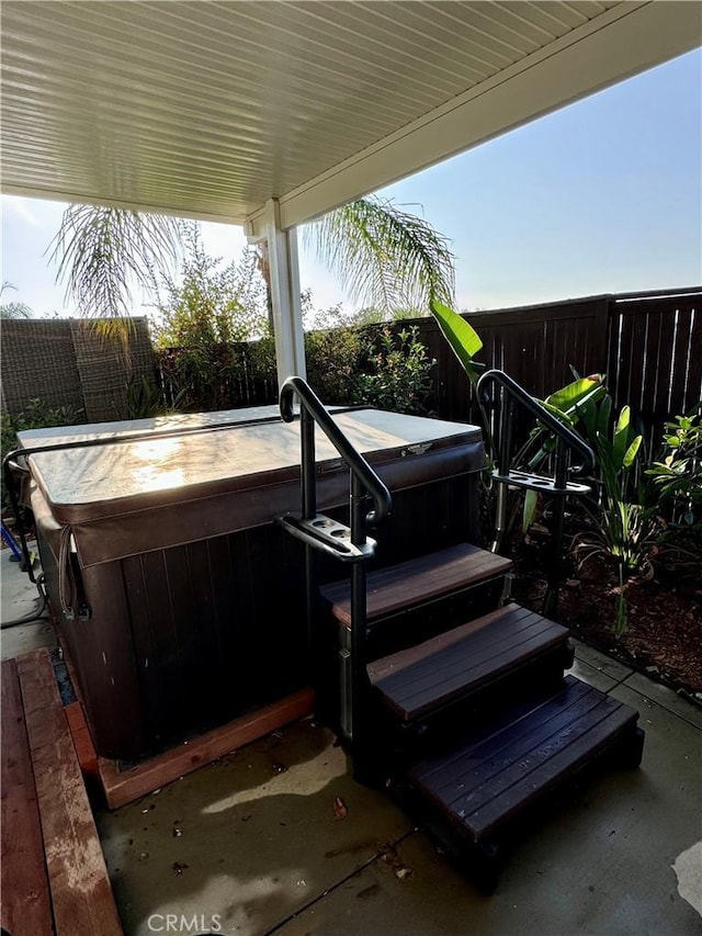 view of patio / terrace featuring a hot tub