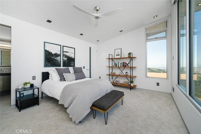 bedroom featuring ceiling fan and light colored carpet