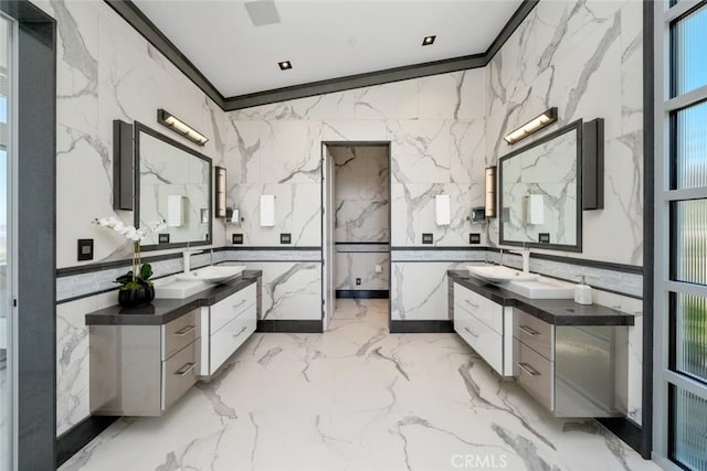 bathroom featuring ornamental molding, tile walls, and vanity