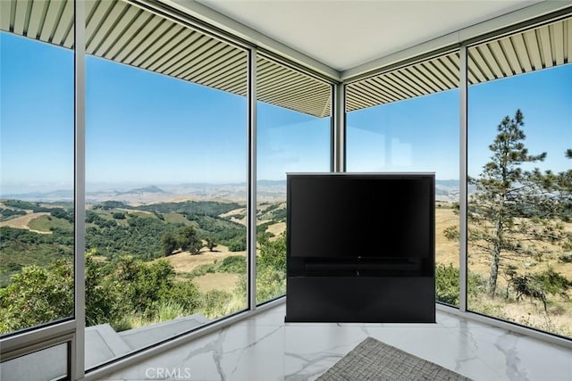 unfurnished sunroom with a healthy amount of sunlight