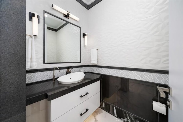 bathroom with tile walls and vanity