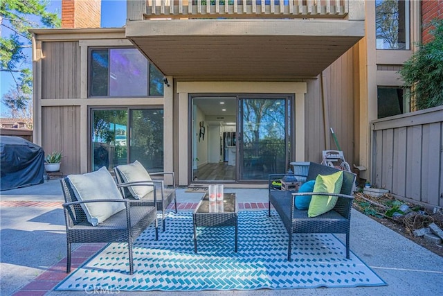 view of patio with a balcony, an outdoor living space, and area for grilling