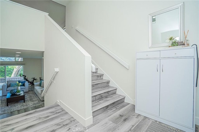 stairway featuring hardwood / wood-style floors