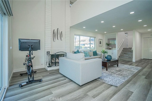 living room featuring a fireplace and light hardwood / wood-style floors