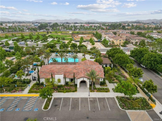 birds eye view of property featuring a mountain view