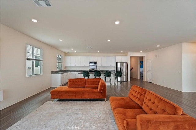 living room featuring dark hardwood / wood-style floors