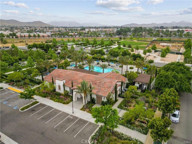 birds eye view of property with a mountain view