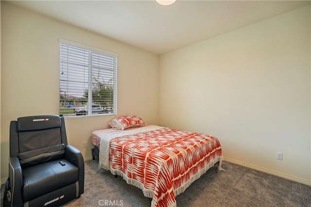 bedroom featuring dark colored carpet