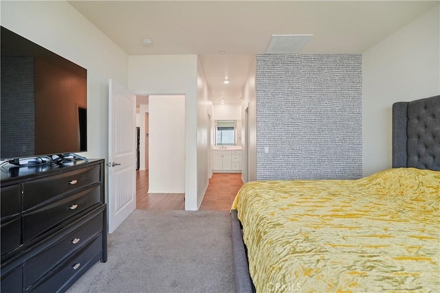 bedroom featuring light carpet