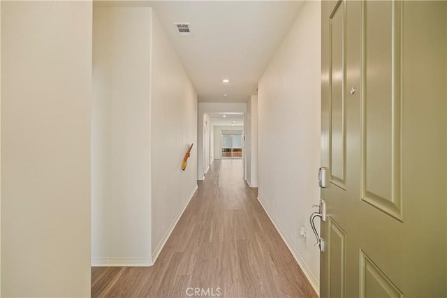 hall with light wood-type flooring