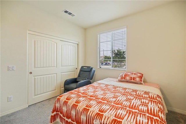 carpeted bedroom featuring a closet