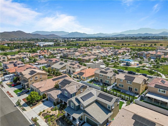 birds eye view of property featuring a mountain view