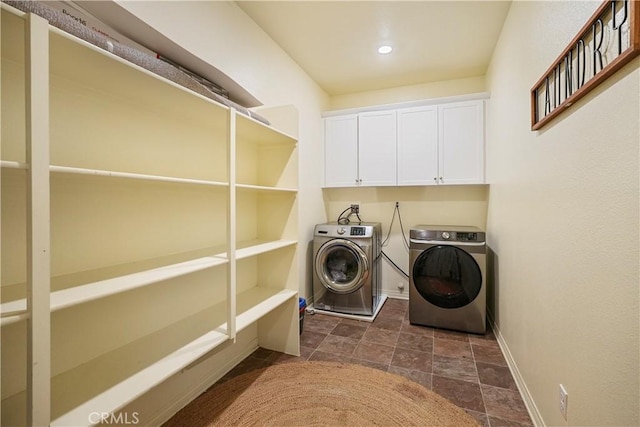 laundry area featuring cabinets and independent washer and dryer