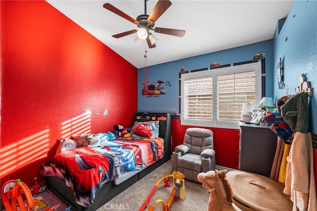 bedroom featuring ceiling fan and carpet