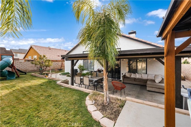 exterior space featuring a patio area, a playground, a yard, and an outdoor living space