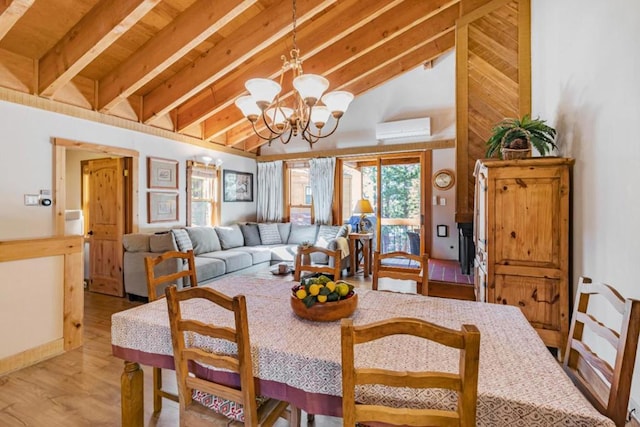 dining room featuring a wall mounted AC, an inviting chandelier, lofted ceiling with beams, and light hardwood / wood-style flooring