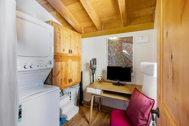 washroom with wood ceiling, dark hardwood / wood-style flooring, and stacked washer / dryer