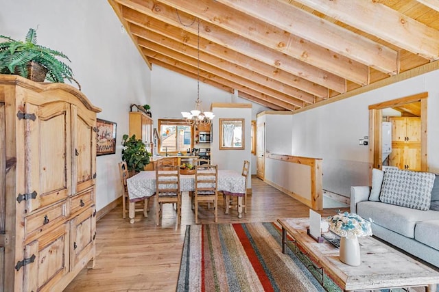 living room featuring beamed ceiling, high vaulted ceiling, light hardwood / wood-style floors, and a notable chandelier