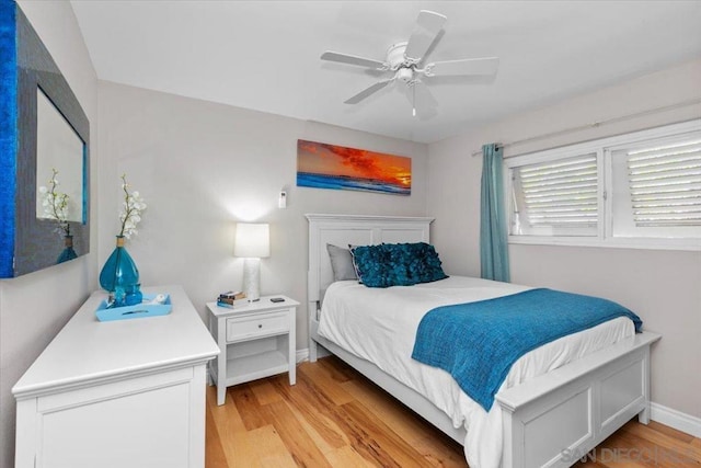 bedroom with ceiling fan and light hardwood / wood-style flooring