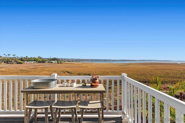 wooden deck featuring a rural view