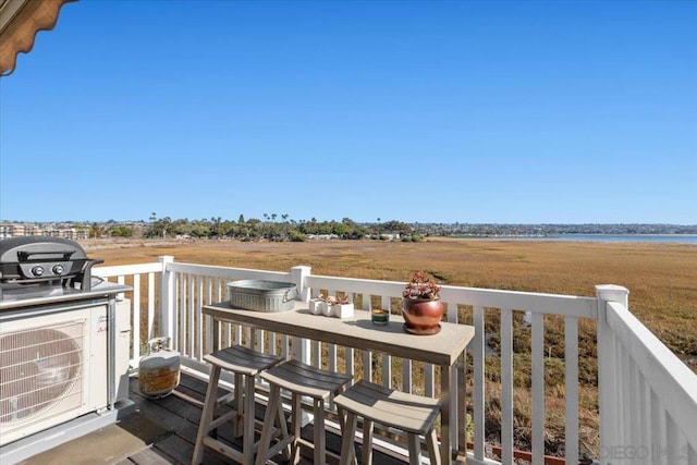 wooden terrace with a rural view