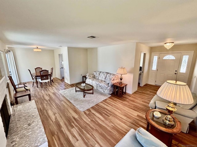 living room with light hardwood / wood-style flooring