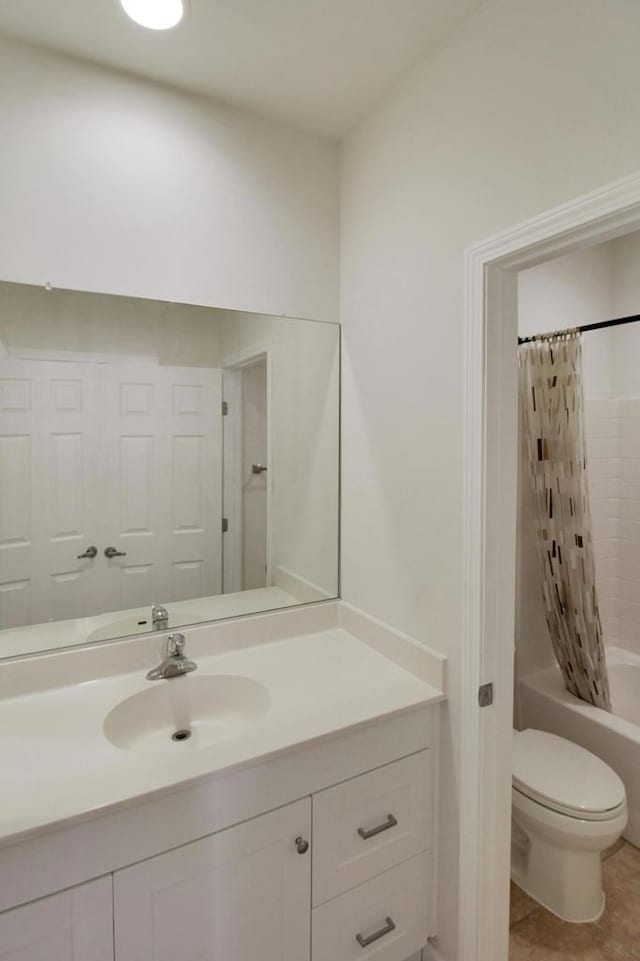 full bathroom featuring toilet, tile patterned flooring, shower / bath combo, and vanity