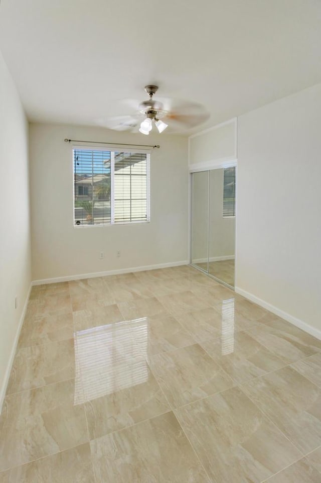 unfurnished room featuring ceiling fan