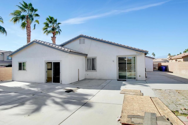 rear view of house with a patio