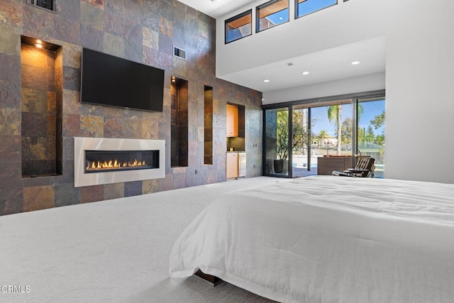 bedroom featuring a fireplace