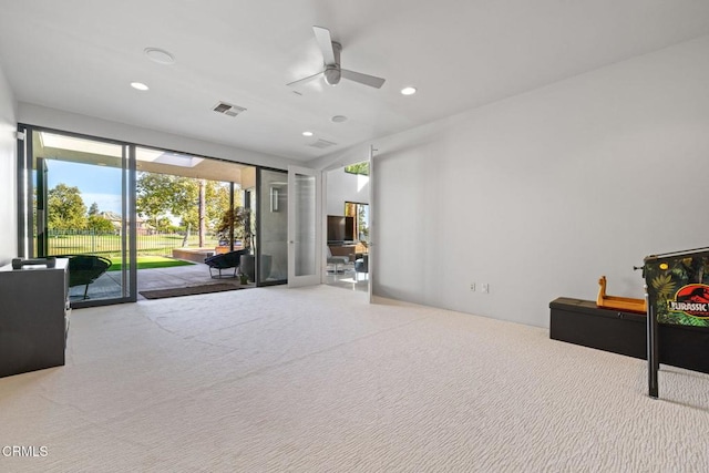 interior space with ceiling fan