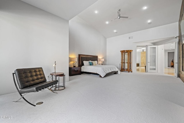 bedroom featuring light colored carpet and vaulted ceiling