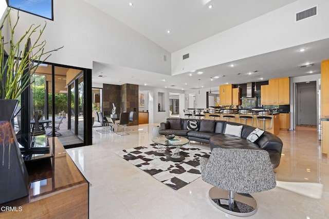 living room with a towering ceiling