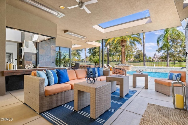 view of patio featuring ceiling fan, a fenced in pool, and an outdoor living space