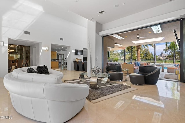 living room with a high ceiling