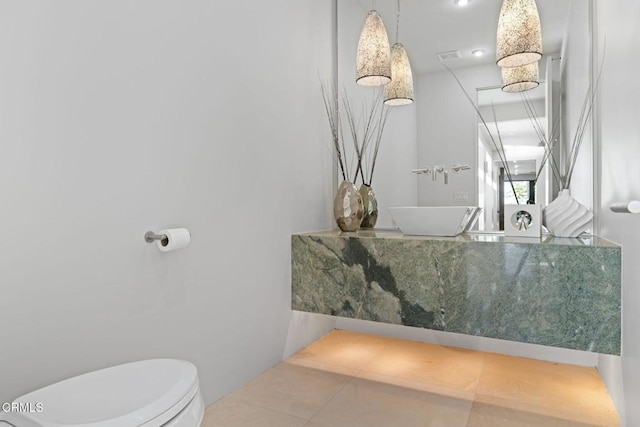 bathroom featuring toilet and tile patterned floors