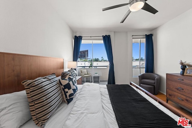 bedroom featuring hardwood / wood-style flooring and ceiling fan