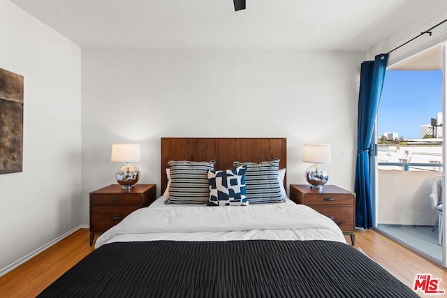 bedroom with ceiling fan and light wood-type flooring