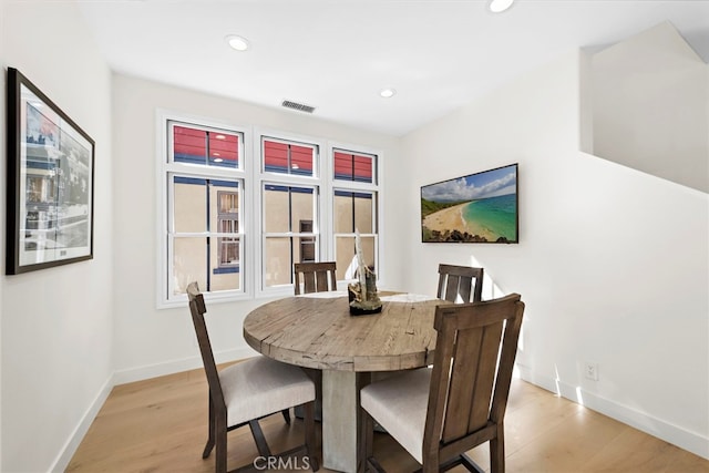 dining room with light wood-type flooring