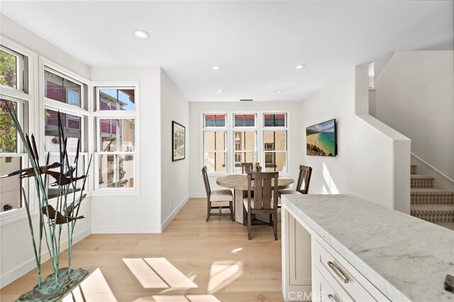 dining room with light hardwood / wood-style flooring