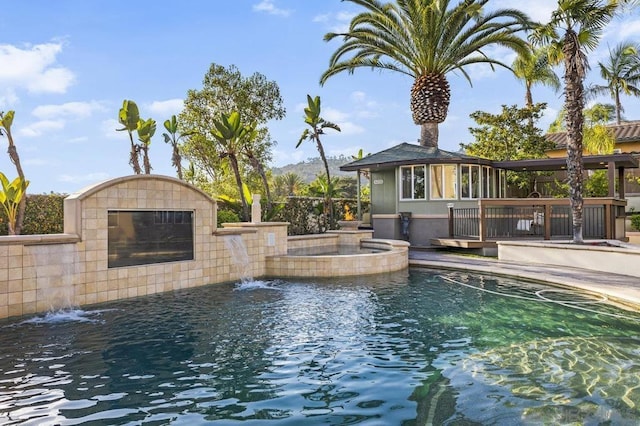 view of pool with pool water feature