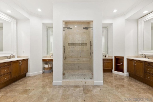 bathroom with ornamental molding, a shower with door, and vanity