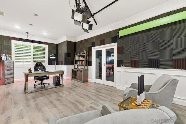 office area with ornamental molding, french doors, and light hardwood / wood-style flooring